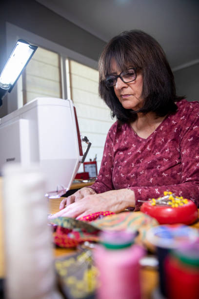 istock Woman Sewing Face Masks during Coronavirus Pandemic 1221067076