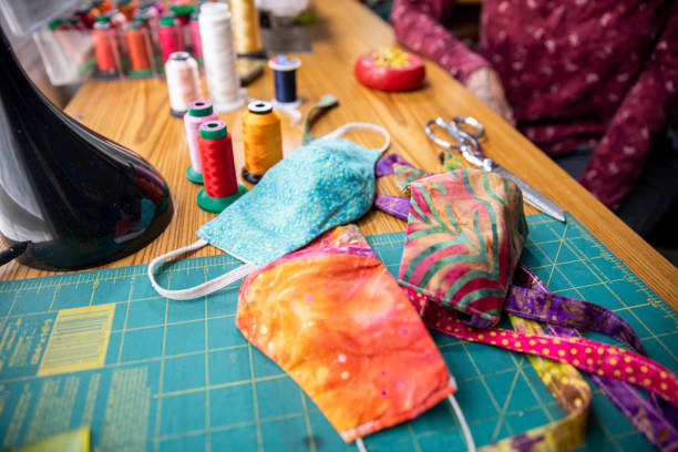 istock Woman Sewing Face Masks during Coronavirus Pandemic 1221067651