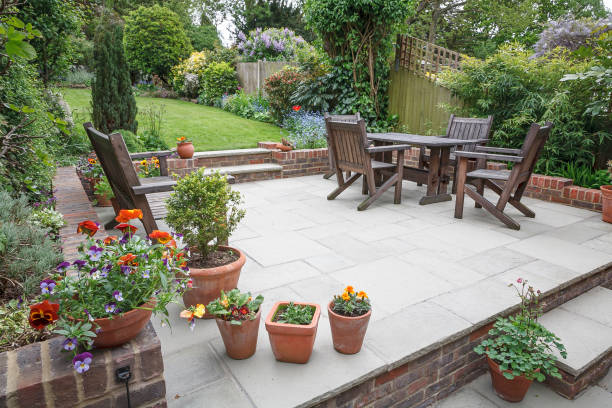Hard landscaping, new luxury patio and garden, UK Hard landscaping, new luxury stone patio and garden of an English home, UK patio photos stock pictures, royalty-free photos & images