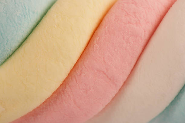 istock Top view on texture of colorful twisted marshmallow candies. 1221068028