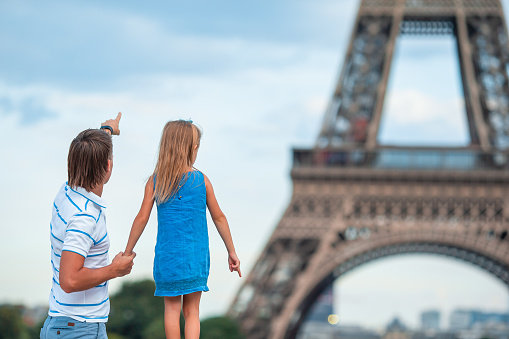 Family on french vacation in Paris background of Eiffel Tower