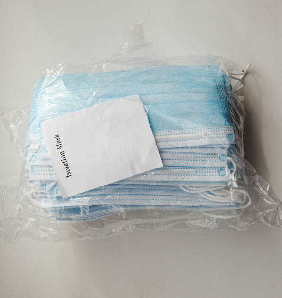 istock Packing new medical masks with instruction. top view. 1221075897