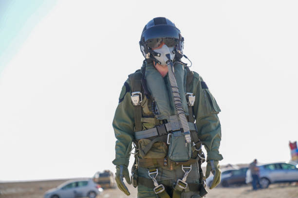 istock Pilot with suit and military air. Fighter pilot portrait posing 1221075973