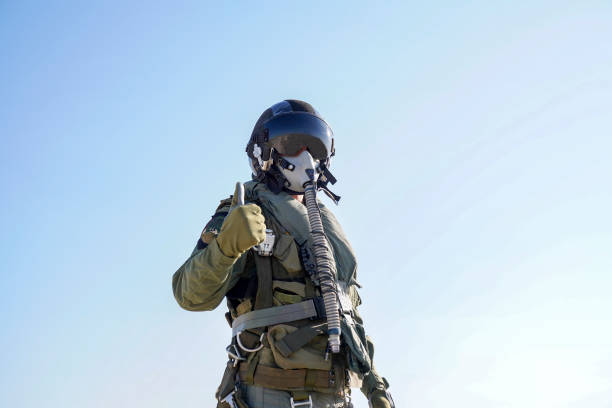 istock Pilot with suit and military air. Fighter pilot portrait posing 1221075976
