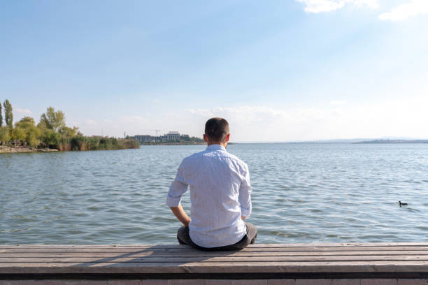 istock lonely and thoughtful man watching the sea, 1221077067