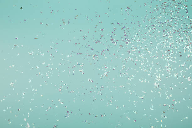 istock Holographic flying sparkles on blue festive background. 1221082197