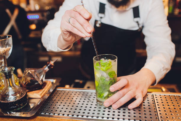 istock Barman makes a cocktail on the bar in the restaurant. 1221082368