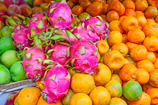 Pitaya, oranges and apples in market in Kerala, southern india
