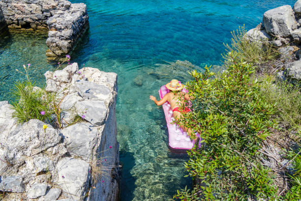 Woman sunbathing on the seabed.