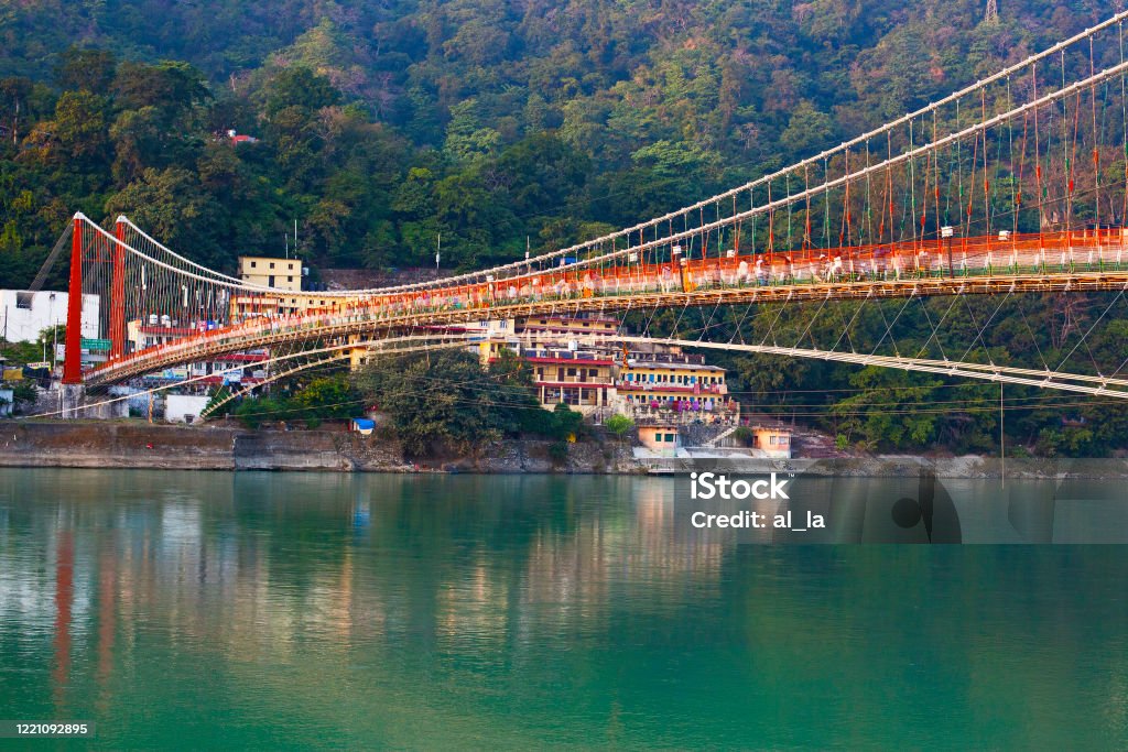 Beautiful Ram Jhula Bridge and Ganga river taken in Rishikesh, India Rishikesh Stock Photo