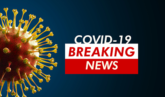 COVUID-19 breaking news concept on virus sitting over royal blue background, Horizontal composition with selective focus and copy space. Health and COVID-19 pandemic concept.