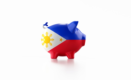 Piggy bank textured with Philippines flag isolated on white background. Horizontal composition with copy space. Clipping path is included. Great use for savings concepts.