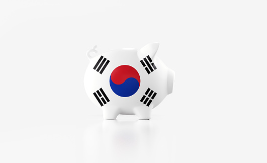Piggy bank textured with South Korean flag isolated on white background. Horizontal composition with copy space. Clipping path is included. Great use for savings concepts.