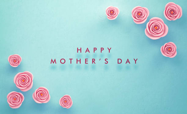 розовые розы окружающие счастливый день матери сообщение на teal фон - mothers day mother single flower family стоковые фото и изображения