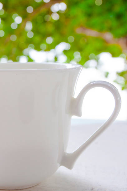 istock Large white cup of coffee on the fresh air 1221093963