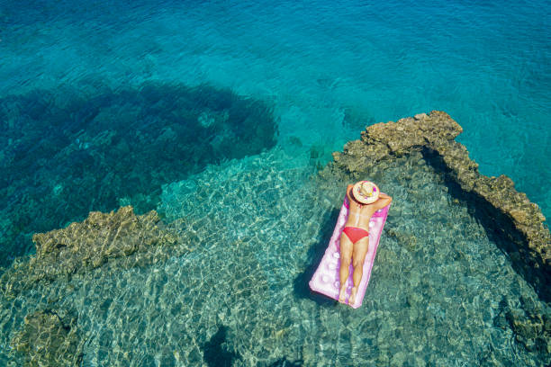 Woman sunbathing on the seabed.