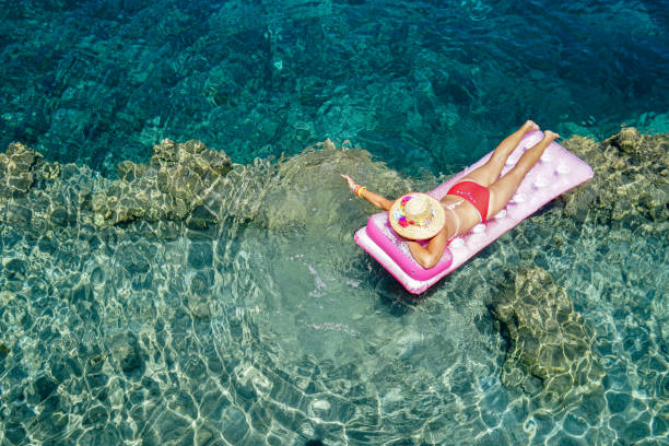 Woman sunbathing on the seabed.