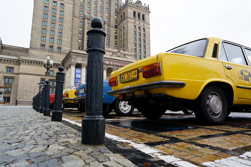 Warsaw, Poland - November 13, 2019: Classic yellow taxis - Polski Fiat 125p and FSO 125p/1500 - waiting for tourists on the parking.