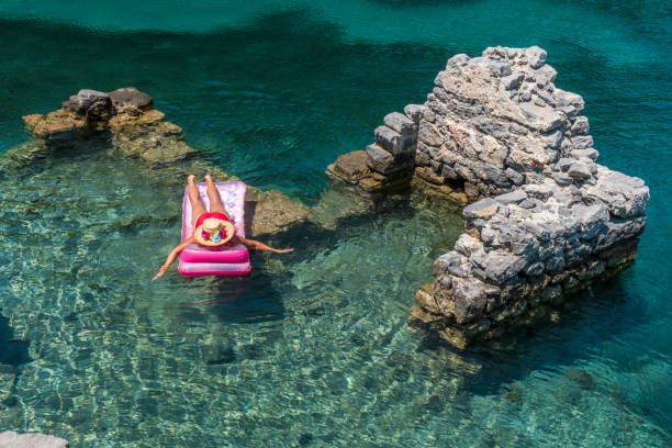 istock Woman sunbathing on the seabed. 1221098855