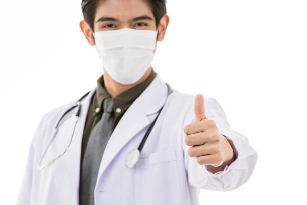 istock Young Asian man in lab coat in white background 1221098941