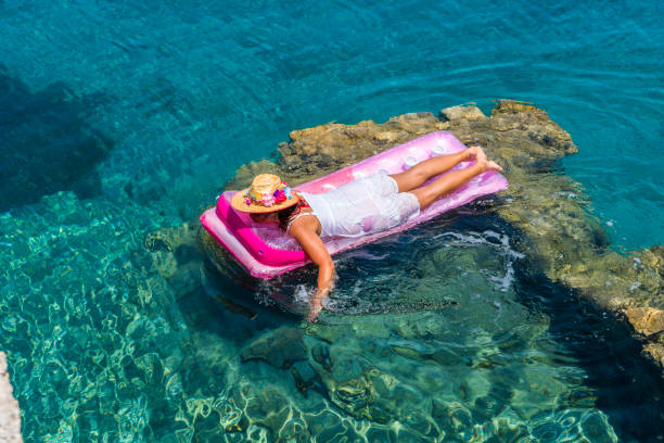 istock Woman sunbathing on the seabed. 1221098968