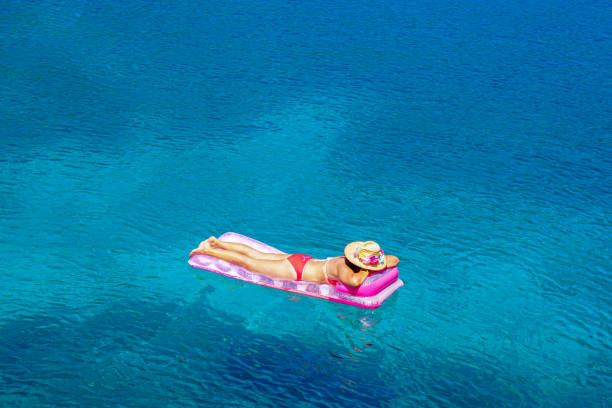 Woman sunbathing on the seabed.
