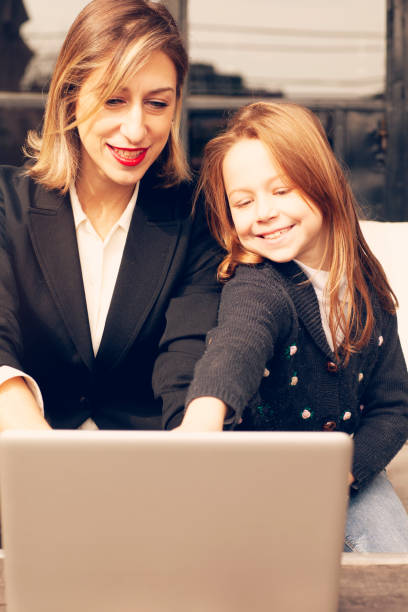 istock Mother helping daughter with homework 1221102694
