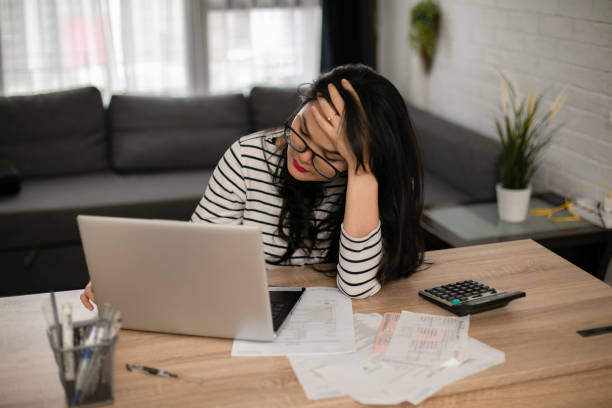 istock Businesswoman calculating data when working from home during coronavirus pandemic 1221103422