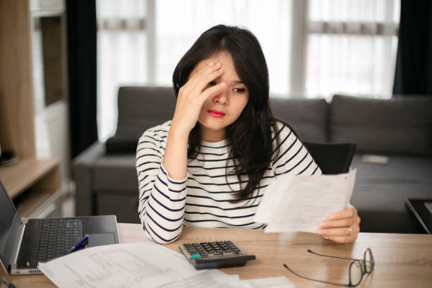 istock Businesswoman calculating data when working from home during coronavirus pandemic 1221103643