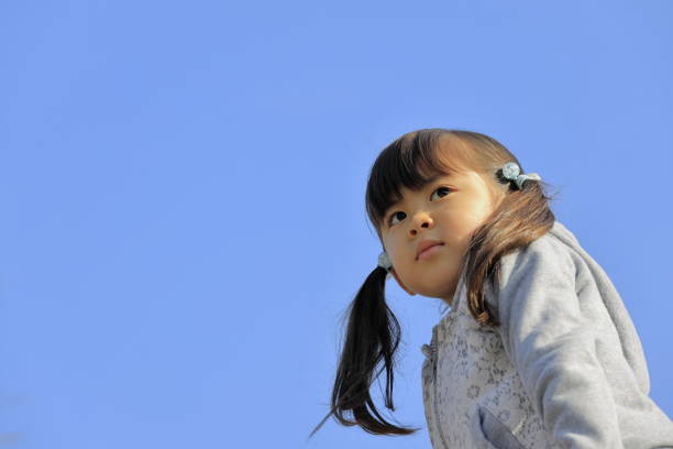 istock Japanese girl under the blue sky (5 years old) 1221104200