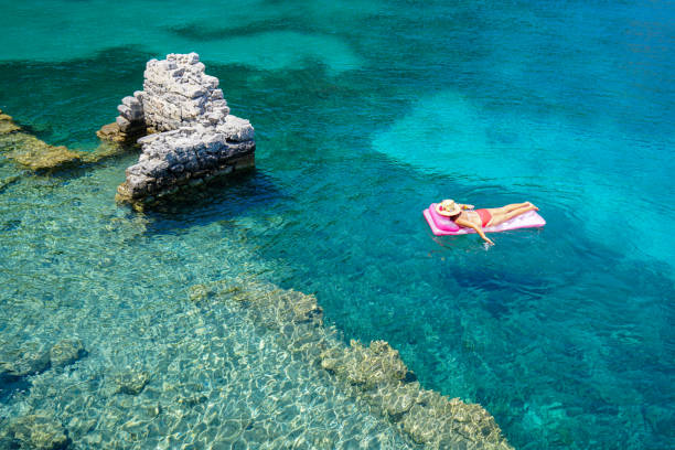 Woman sunbathing on the seabed.