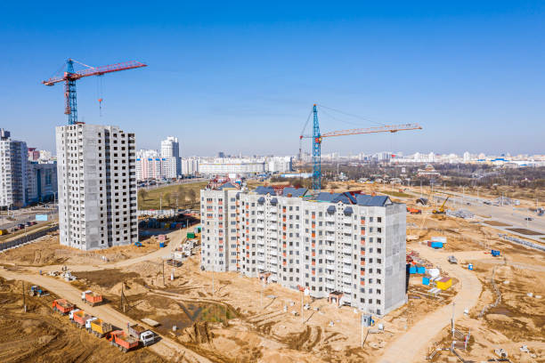 istock new multistory residential buildings under construction against blue sky background 1221113212