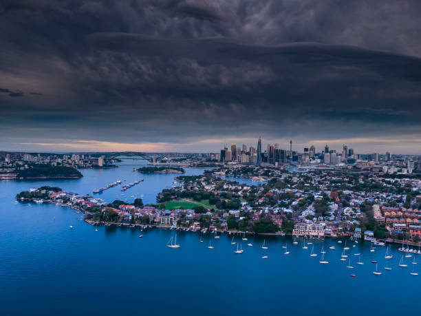 istock Panoramic drone aerial view over Sydney harbour on a cloudy sunset afternoon showing the nice colours of the harbour foreshore 1221114765