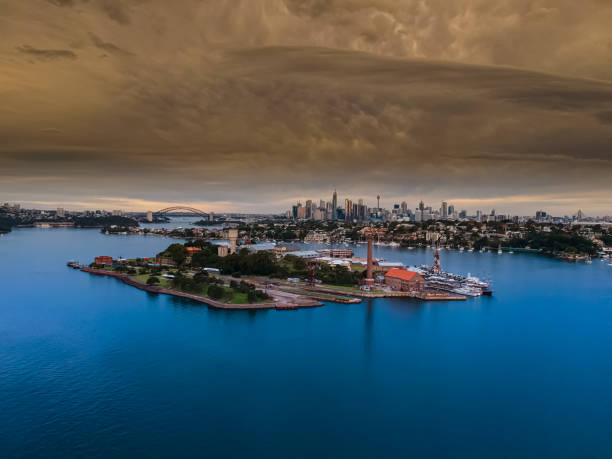 istock Panoramic drone aerial view over Sydney harbour on a cloudy sunset afternoon showing the nice colours of the harbour foreshore 1221114767
