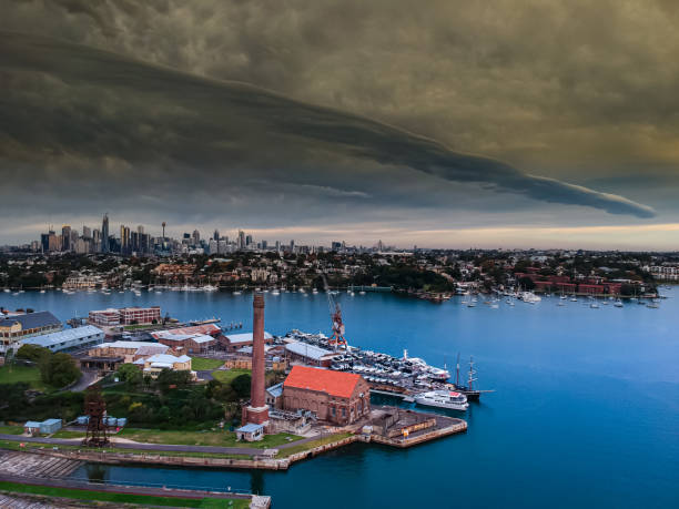istock Panoramic drone aerial view over Sydney harbour on a cloudy sunset afternoon showing the nice colours of the harbour foreshore 1221114784