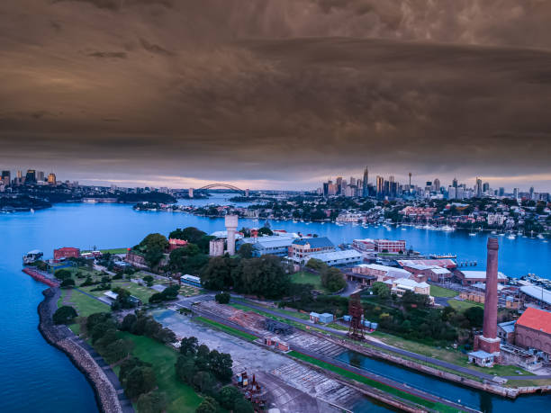 istock Panoramic drone aerial view over Sydney harbour on a cloudy sunset afternoon showing the nice colours of the harbour foreshore 1221114798