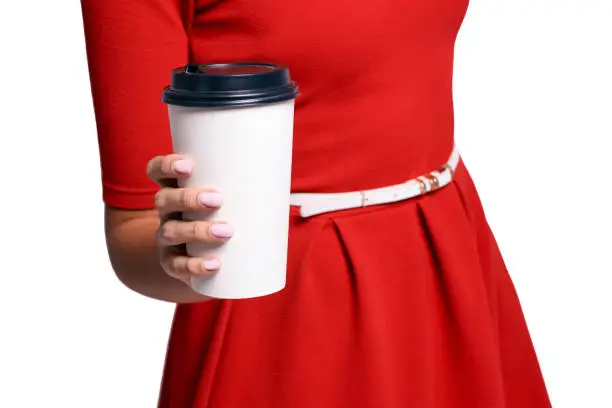 White coffee take away cup. Girl hand holding latte mug. Red dress woman. Female nail.