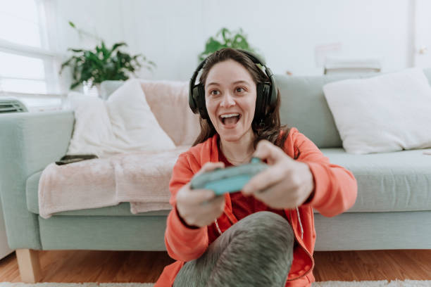 istock Woman playing multiplayer online games 1221115766