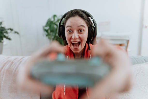 istock Woman playing multiplayer online games 1221115772