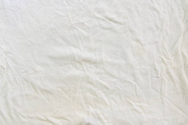 istock Crumpled white linen fabric cotton for wallpaper design 1221117477