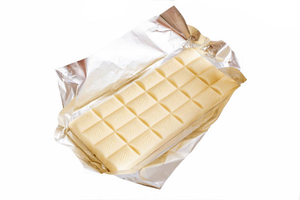 istock Sweet white chocolate plate isolated on white 1221117596