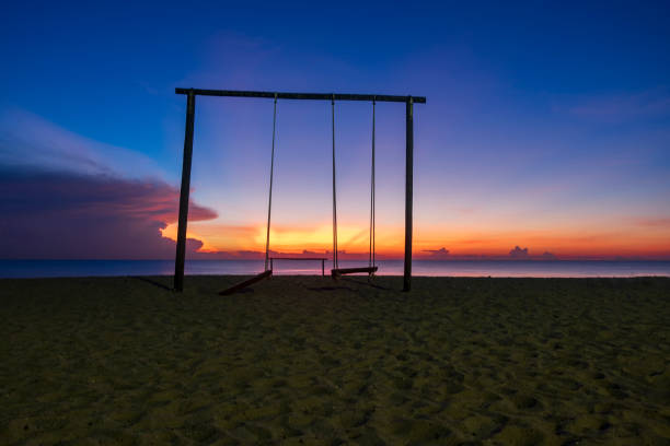 istock beautiful tropical beach sunrise sea view. soft wave hitting sandy beach 1221117631