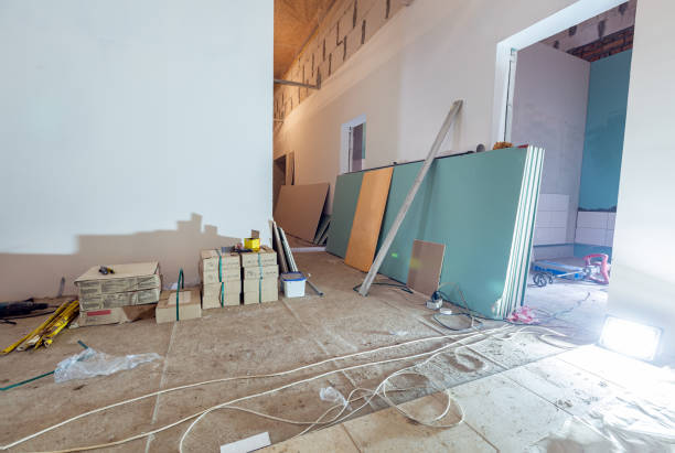 istock Working process of installing plasterboard or drywall for making gypsum walls in apartment is under construction, remodeling, renovation, extension, restoration and reconstruction. Concept of home improvement or renovate. 1221119430