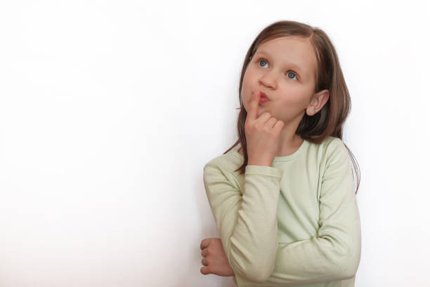 istock Girl stands thinking 1221119534