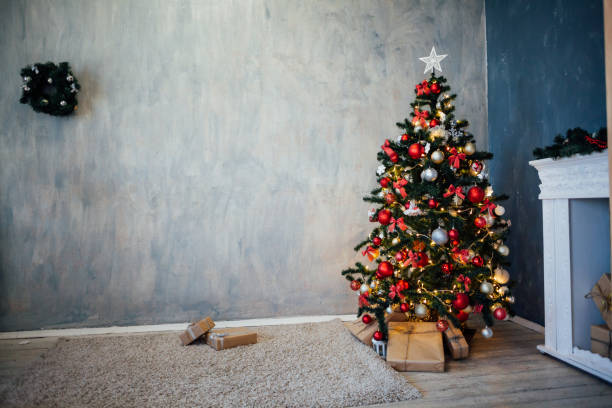 istock Christmas tree with presents, Garland lights new year 1221121391