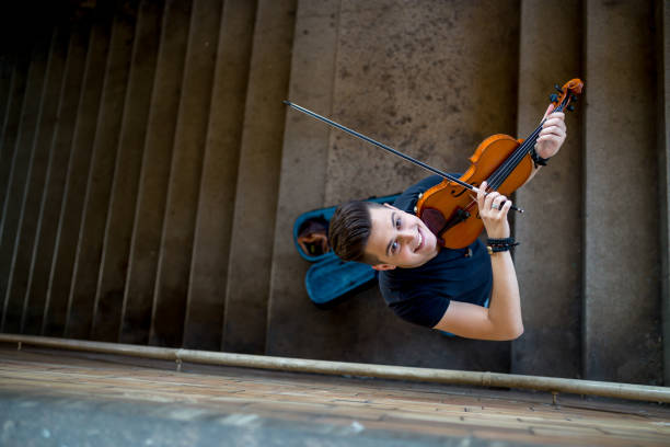 istock Street musician playing violin 1221121411