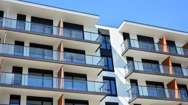 istock Modern condo building with big windows and modern facade. 1221124925