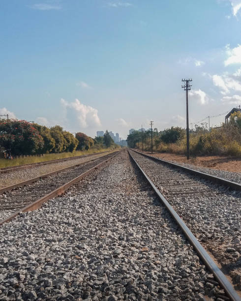 Railroad and stones with rusty iron railway