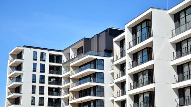 istock Modern condo building with big windows and modern facade. 1221125002