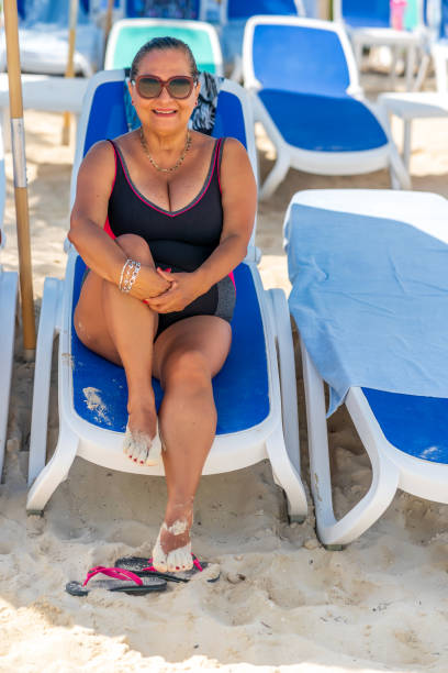 istock Senior Hispanic woman on Caribbean beach 1221125004